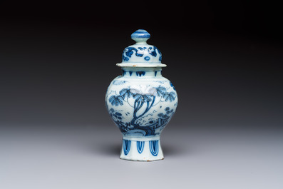 A blue and white Dutch Delft covered vase and two polychrome plates, 17/18th C.