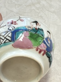 A fine Chinese famille rose cup and saucer with a couple on a terrace, Yongzheng/Qianlong