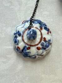 A Chinese blue and white tea caddy, a teapot and an Imari-style teapot, Kangxi/Yongzheng
