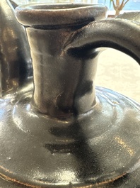 A Chinese Yaozhou black-glazed ewer with a ribbed body, Song