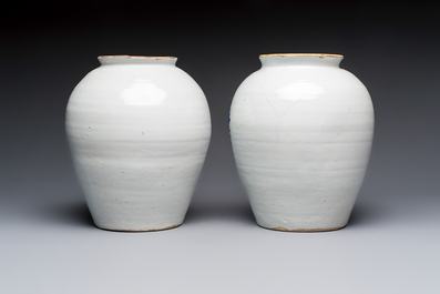 A pair of blue and white Dutch Delft 'Leaping Unicorn' tobacco jars, 18th C.