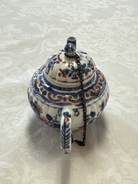 A Chinese blue and white tea caddy, a teapot and an Imari-style teapot, Kangxi/Yongzheng