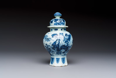 A blue and white Dutch Delft covered vase and two polychrome plates, 17/18th C.