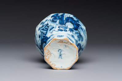 A blue and white Dutch Delft covered vase and two polychrome plates, 17/18th C.