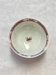 A fine Chinese famille rose cup and saucer with a couple on a terrace, Yongzheng/Qianlong