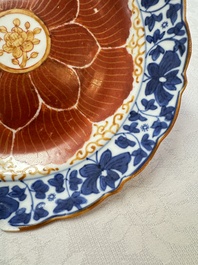 Five Chinese iron-red, blue and white plates with floral design, Qianlong/Jiaqing