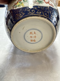 A Chinese famille verte gilt-decorated blue-ground 'Dragon and Phoenix' vase, Kangxi mark, 19th C.