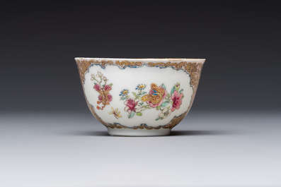 A fine Chinese Canton famille rose gilt-decorated cup and saucer with figural design, Yongzheng/Qianlong