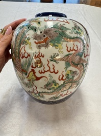 A Chinese famille verte gilt-decorated blue-ground 'Dragon and Phoenix' vase, Kangxi mark, 19th C.