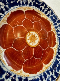 Five Chinese iron-red, blue and white plates with floral design, Qianlong/Jiaqing