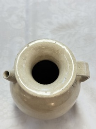 A Chinese cream-glazed ewer with a barrel-shaped body, Hebei/Henan provinces, Tang/Five Dynasties