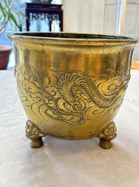 A large Chinese bronze 'Dragon' tripod censer, 19th C.