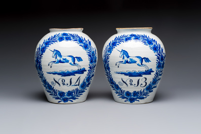 A pair of blue and white Dutch Delft 'Leaping Unicorn' tobacco jars, 18th C.
