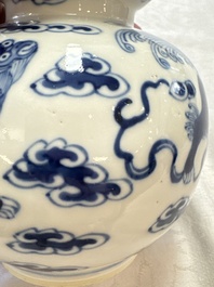 A pair of Chinese blue and white 'Buddhist Lions' triple gourd vases on reticulated wooden stands, 19th C.