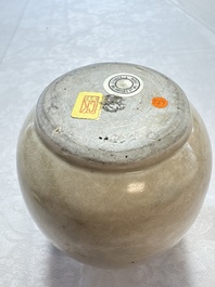 A Chinese cream-glazed ewer with a barrel-shaped body, Hebei/Henan provinces, Tang/Five Dynasties