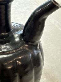 A Chinese Yaozhou black-glazed ewer with a ribbed body, Song