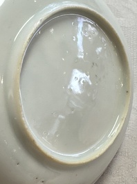 A fine Chinese famille rose cup and saucer with a couple on a terrace, Yongzheng/Qianlong