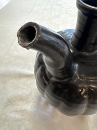 A Chinese Yaozhou black-glazed ewer with a ribbed body, Song