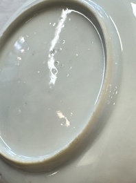 A fine Chinese famille rose cup and saucer with a couple on a terrace, Yongzheng/Qianlong
