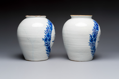 A pair of blue and white Dutch Delft 'Leaping Unicorn' tobacco jars, 18th C.