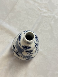 A pair of Chinese blue and white 'Buddhist Lions' triple gourd vases on reticulated wooden stands, 19th C.