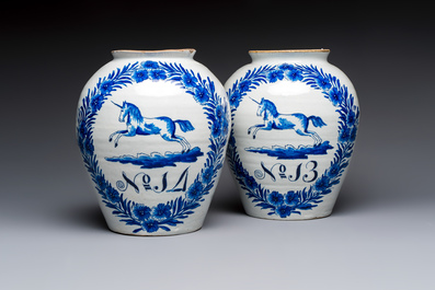 A pair of blue and white Dutch Delft 'Leaping Unicorn' tobacco jars, 18th C.