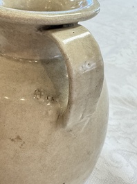 A Chinese cream-glazed ewer with a barrel-shaped body, Hebei/Henan provinces, Tang/Five Dynasties