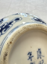 A pair of Chinese blue and white 'Buddhist Lions' triple gourd vases on reticulated wooden stands, 19th C.