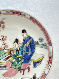 A fine Chinese famille rose cup and saucer with a couple on a terrace, Yongzheng/Qianlong
