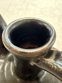 A Chinese Yaozhou black-glazed ewer with a ribbed body, Song