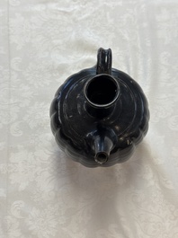 A Chinese Yaozhou black-glazed ewer with a ribbed body, Song