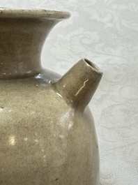 A Chinese cream-glazed ewer with a barrel-shaped body, Hebei/Henan provinces, Tang/Five Dynasties