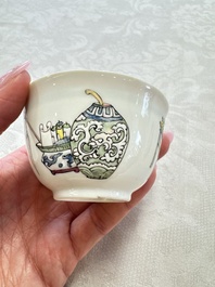 A fine Chinese famille rose 'Court Lady and a Boy' cup and saucer, Yongzheng