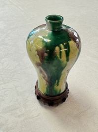 A Chinese sancai-glazed 'Meiping' vase on a wooden stand, 19th C.