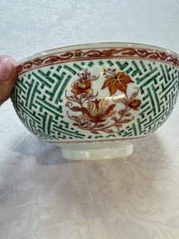 A Chinese famille verte relief-carved bowl with gilt iron-red floral design, Kangxi