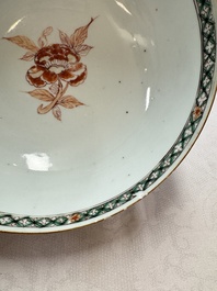 A Chinese famille verte relief-carved bowl with gilt iron-red floral design, Kangxi