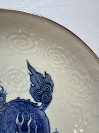 A Japanese Arita blue and white Kakiemon-style 'Kirin' plate with underglaze relief design, Edo, 18th C.