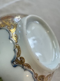 A fine Chinese Canton famille rose gilt-decorated cup and saucer with figural design, Yongzheng/Qianlong