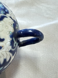 Three Chinese famille rose blue- and yellow-ground teapots and covers for the Straits or Peranakan market, Tongzhi marks, 19th C.