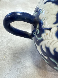 Three Chinese famille rose blue- and yellow-ground teapots and covers for the Straits or Peranakan market, Tongzhi marks, 19th C.