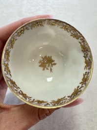 A fine Chinese Canton famille rose gilt-decorated cup and saucer with figural design, Yongzheng/Qianlong