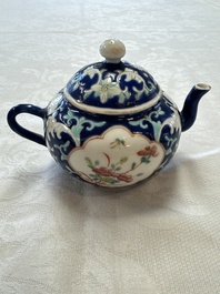 Three Chinese famille rose blue- and yellow-ground teapots and covers for the Straits or Peranakan market, Tongzhi marks, 19th C.