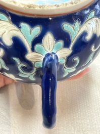 Three Chinese famille rose blue- and yellow-ground teapots and covers for the Straits or Peranakan market, Tongzhi marks, 19th C.