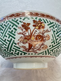 A Chinese famille verte relief-carved bowl with gilt iron-red floral design, Kangxi