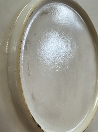 A fine Chinese Canton famille rose gilt-decorated cup and saucer with figural design, Yongzheng/Qianlong