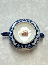 Three Chinese famille rose blue- and yellow-ground teapots and covers for the Straits or Peranakan market, Tongzhi marks, 19th C.