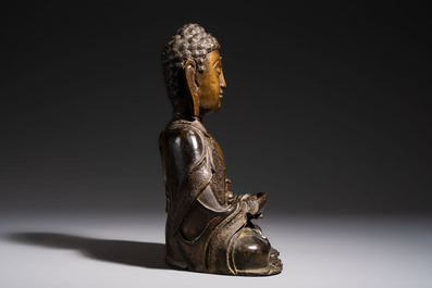 A Chinese bronze seated Buddha, Ming