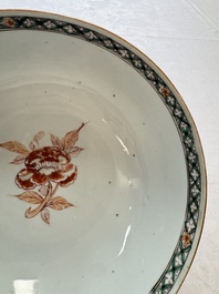 A Chinese famille verte relief-carved bowl with gilt iron-red floral design, Kangxi