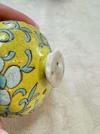 Three Chinese famille rose blue- and yellow-ground teapots and covers for the Straits or Peranakan market, Tongzhi marks, 19th C.