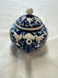 Three Chinese famille rose blue- and yellow-ground teapots and covers for the Straits or Peranakan market, Tongzhi marks, 19th C.